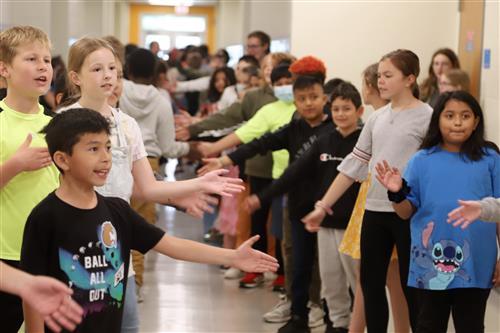 Starr students high-fiving each other in hallway